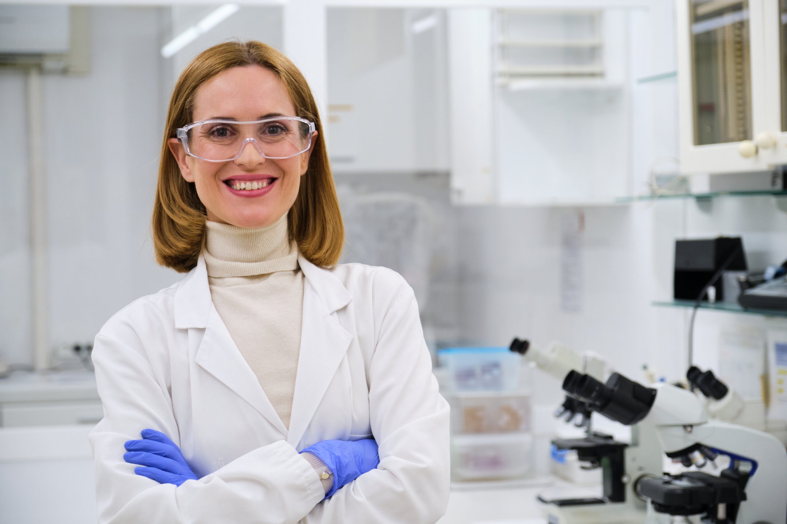 Female professional researcher smiling and looking at camera.